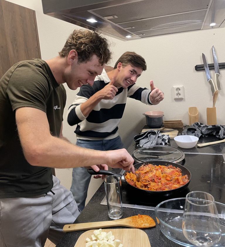 students cooking in the student residence